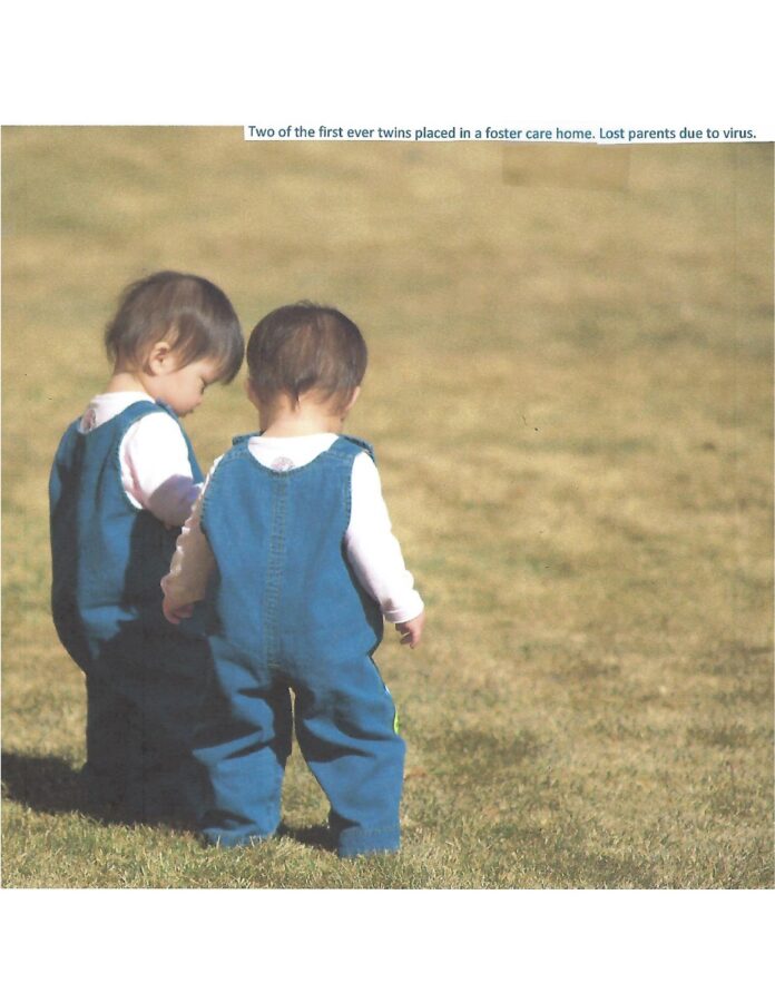 Two children with new home